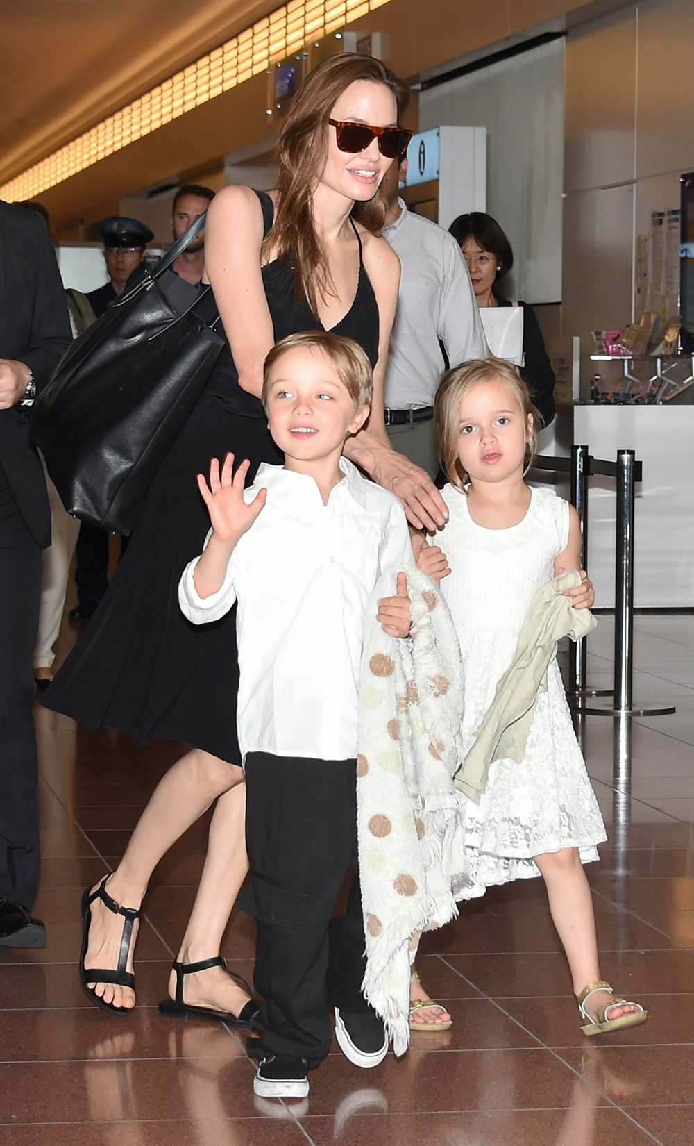 Knox Jolie-Pitt, Angelina Jolie and Vivienne Jolie-Pitt are seen upon arrival at Haneda Airport on June 21, 2014 in Tokyo, Japan