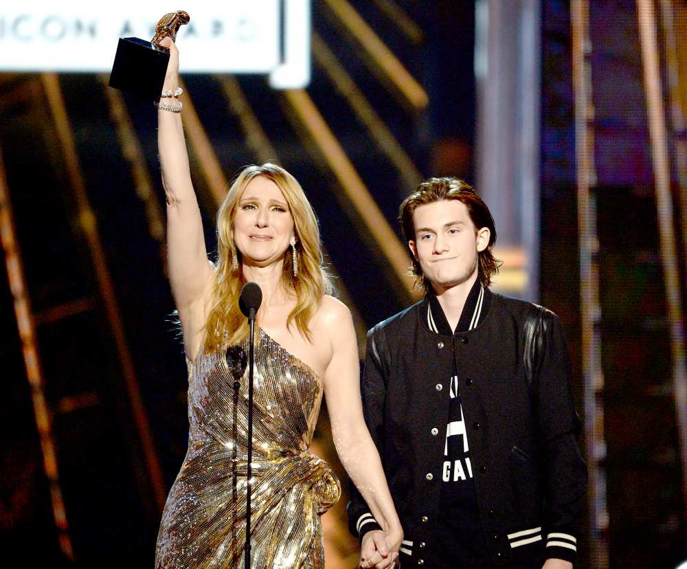 Celine Dion accepts the Billboard Icon-Award from son Rene Charles Angelil onstage during the 2016 Billboard Music Awards.