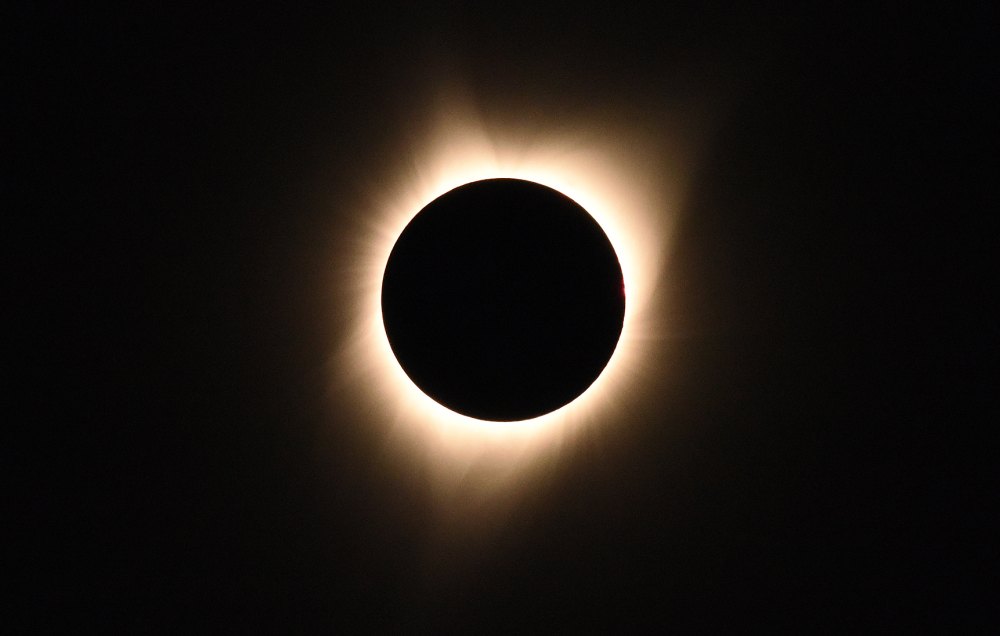 The sun's corona is visible as the moon passes in front of the sun during a total solar eclipse at Big Summit Prairie ranch in Oregon's Ochoco National Forest near the city of Mitchell on August 21, 2017.