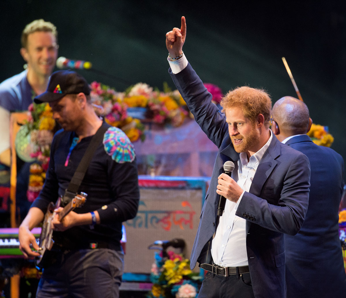 Prince Harry performs onstage with Coldplay