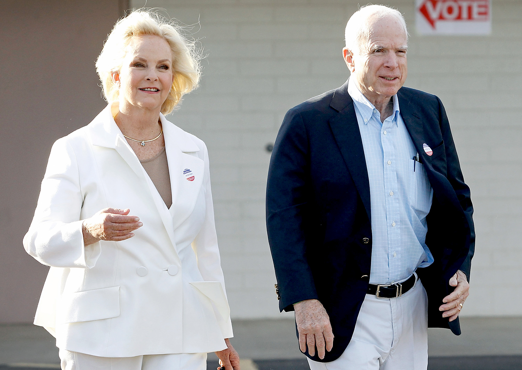 John McCain and his wife Cindy exit the Mountain View Christian Church polling place after casting their vote on November 8, 2016 in Phoenix, Arizona.
