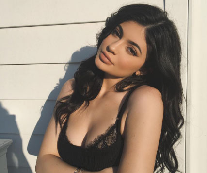 Kylie Jenner shows off her cleavage in a black lacy bra