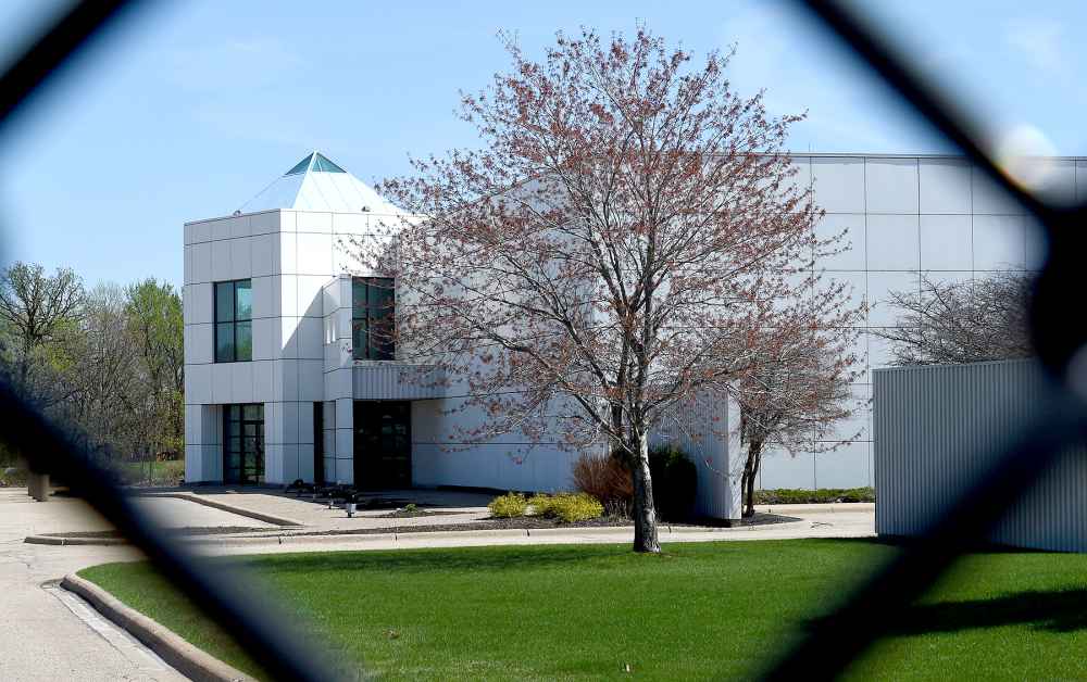 The entrance of the Paisley Park compound of music legend Prince is seen through a fence in Minneapolis, Minnesota, on April 22, 2016.